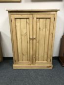 A reclaimed pine two door cabinet