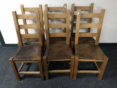 A set of six contemporary ladder back dining chairs with inter-changeable seats