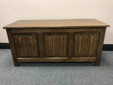 An oak linen fold blanket box