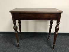 A nineteenth century mahogany turn over topped tea table