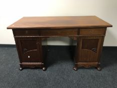 An antique mahogany twin pedestal desk