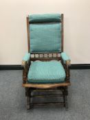 An Edwardian oak rocking chair