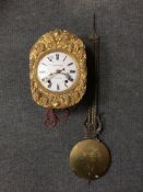 A French wall clock with enamelled dial, with pendulum, the dial signed Theophile Amiet.