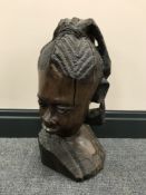 A carved hardwood head of a lady