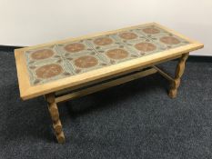 A blond oak tile top coffee table