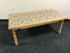 A blond oak tile top coffee table