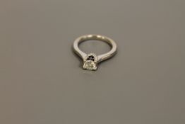 A diamond solitaire ring, by Vera Wang, the brilliant cut stone weighing an estimated 0.