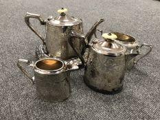 A four piece Walker & Hall Sheffield plated tea service and a china teapot stand