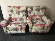 A pair of House of Fraser swivel armchairs upholstered in a button fabric RRP £1200