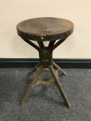 A mid-20th century circular Evertaut industrial stool on four legs