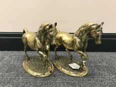 A pair of brass figures of horses