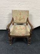 An early 20th century carved oak armchair