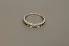 An 18ct gold diamond half eternity ring