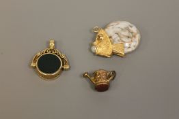 Three various gold fobs/charms