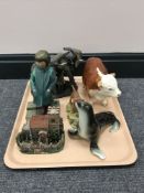 A china figure of a Hereford bull, together with a contemporary figure of an elephant family,