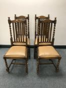 A set of four oak barley-twist dining chairs