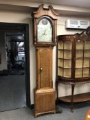 An early 19th century oak longcase clock with painted dial,