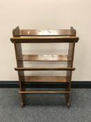 A set of mid-20th century open bookshelves