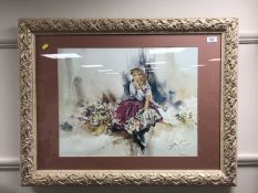 After Gordon King : A lady by a basket of flowers, colour print, framed.