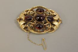Large and impressive Victorian gold brooch set with cabochon garnets