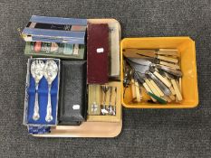 A tray of assorted unboxed and boxed table cutlery, teaspoons,
