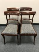 A set of four late Victorian mahogany dining chairs