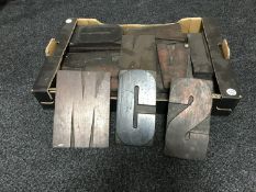 A box of wooden printer's letters CONDITION REPORT: Most are around 12cm by 22cm.