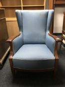 An early 20th century mahogany framed armchair upholstered in blue fabric