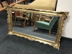 An ornate gilt framed mirror
