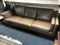 A mid 20th century Danish brown leather three seater settee