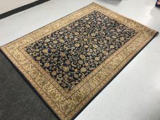 A Laura Ashley rug on blue ground together with one other fringed rug