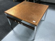 A Danish rosewood copper topped coffee table on chrome legs