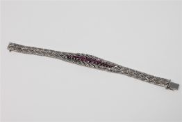A fine quality ruby and diamond bracelet in 18ct white gold, 52g.