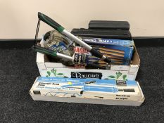 A box of cased power tools including heat gun,