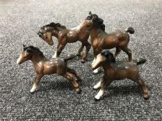 Four brown gloss Beswick standing foals (4)