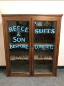 A Victorian and later display cabinet with advertising decoration