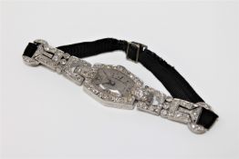 Superb quality Lady's platinum cocktail watch set with approximately 2.