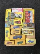 A tray of thirteen boxed Dinky die cast vehicles together with a Dinky Toys sign pack