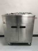 A Parry stainless steel double door four-pot bain marie cabinet