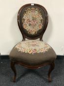 A late 19th century mahogany bedroom chair upholstered in floral tapestry
