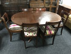 An inlaid mahogany circular pedestal dining table with leaf together with six single chairs