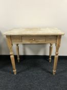 A pine side table fitted a drawer