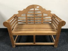 A child's teak Lindsey plantation scroll arm settee