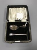 A Sterling silver cased baby spoon and pusher