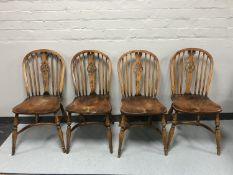 A set of six 20th century elm wheel backed country kitchen chairs