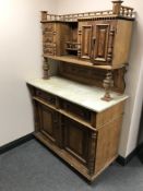 A late 19th century continental marble topped walnut cabinet