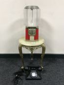 A late twentieth century sweet dispenser together with a gilt and onyx plant table and retro style