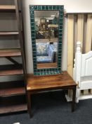 A Danish rosewood coffee table together with a rosewood tiled mirror