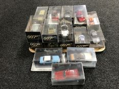 A tray of twenty James Bond die cast vehicles in plastic display cases
