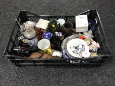 A box containing assorted plates, chins, beer steins,